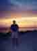 Mark on beach at sunset